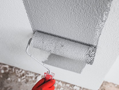 Applying Finish Over A Wall With A Paint Roller