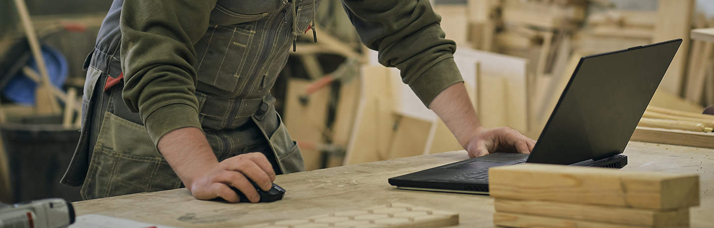 Tradesman Using Laptop Computer