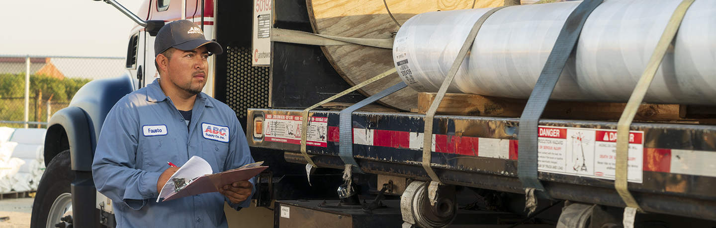 ABC Supply Driver Doing A Delivery Safety Check