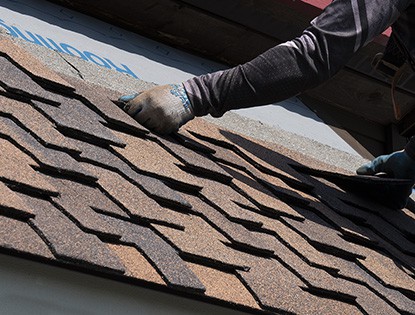 Close Up of Composite Shingles Being Installed