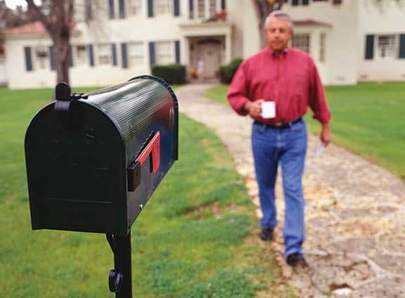 Man Walking Out To His Mailbox
