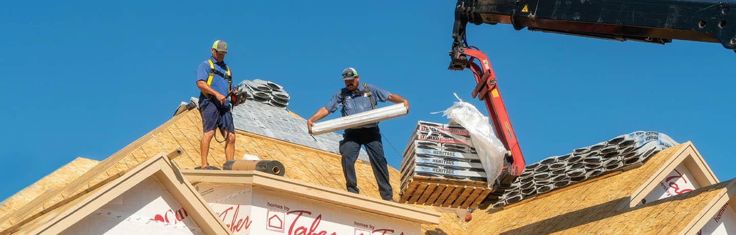 Contractors on a the Roof of a Home